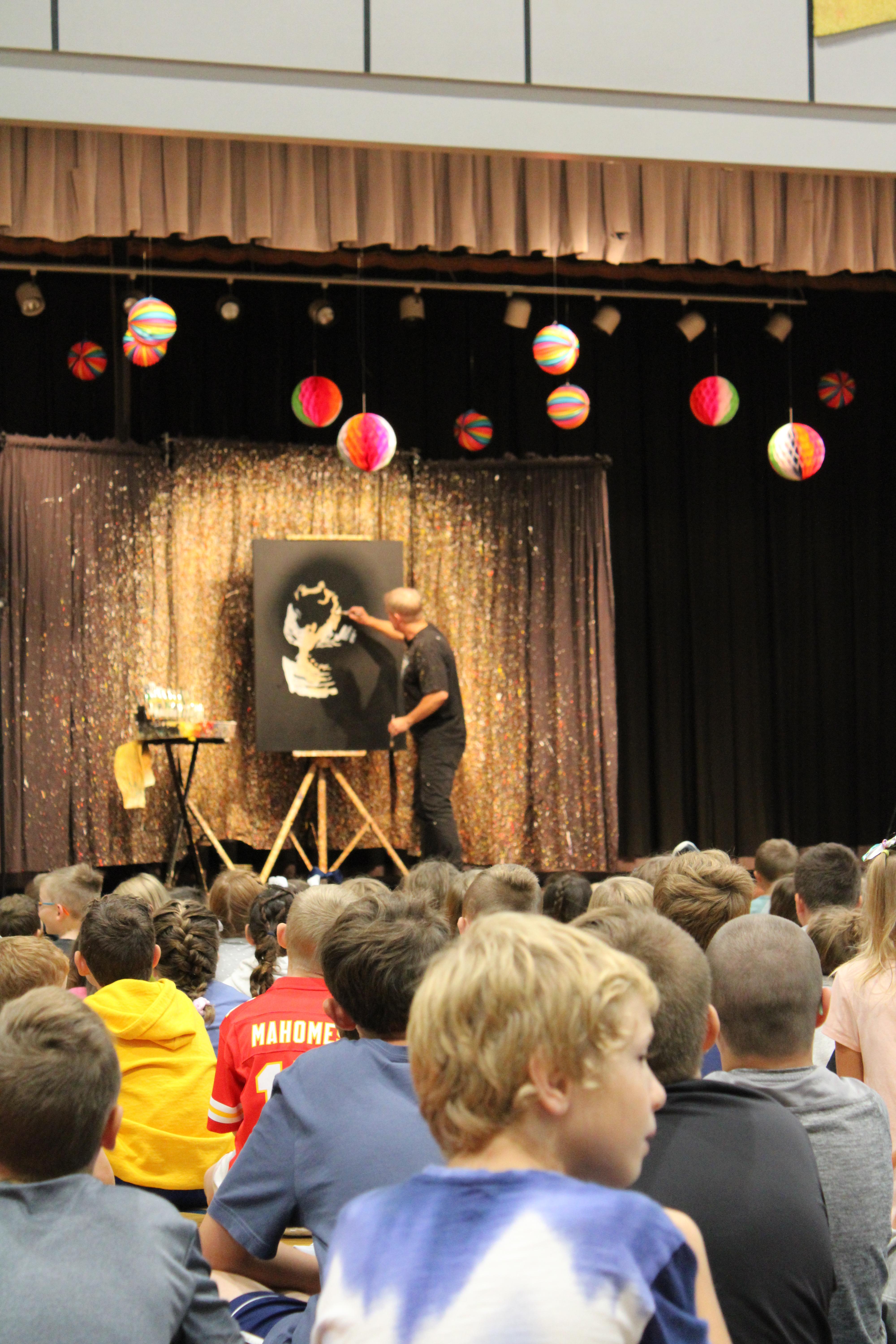 pic of painter entertaining students